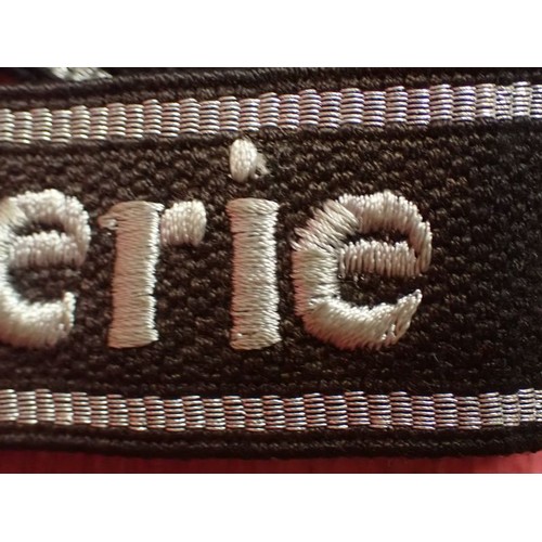 13 - WW2 SS-Feldgendarmerie cuff title

Aluminium wirework edging. The script is in a grey-silver-coloure... 
