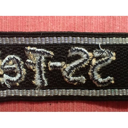 13 - WW2 SS-Feldgendarmerie cuff title

Aluminium wirework edging. The script is in a grey-silver-coloure... 