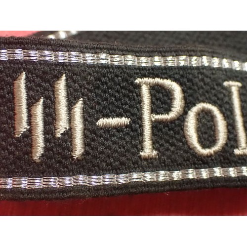 24 - WW2 German SS - Polizei - Division cuff title

Aluminium wirework edging. 455 mm long. Folded and st... 