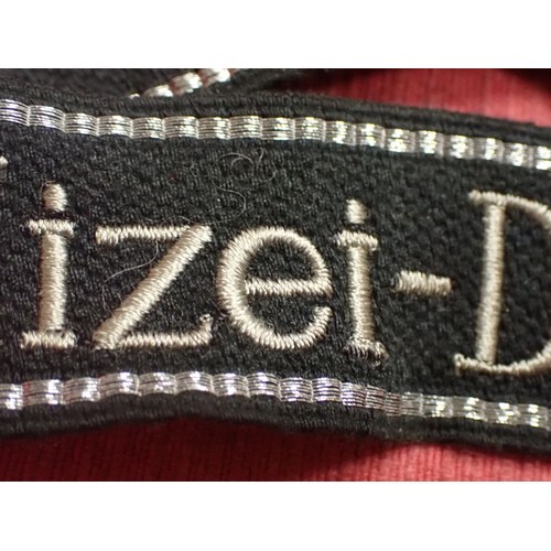 24 - WW2 German SS - Polizei - Division cuff title

Aluminium wirework edging. 455 mm long. Folded and st... 