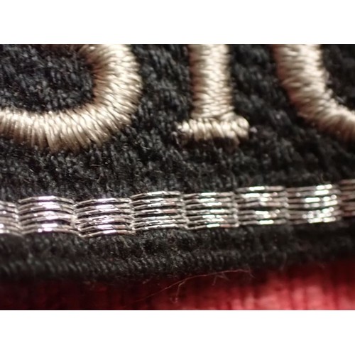 24 - WW2 German SS - Polizei - Division cuff title

Aluminium wirework edging. 455 mm long. Folded and st... 