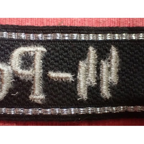 24 - WW2 German SS - Polizei - Division cuff title

Aluminium wirework edging. 455 mm long. Folded and st... 