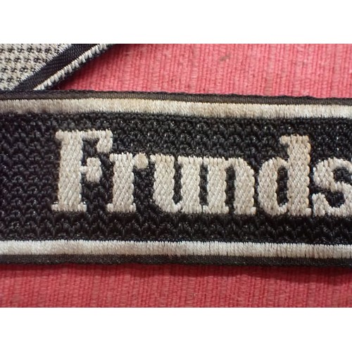 25 - WW2 German SS Frundsberg cuff title

Bevo cuff title. Folded and stitched ends. 462 mm long. Some mi... 