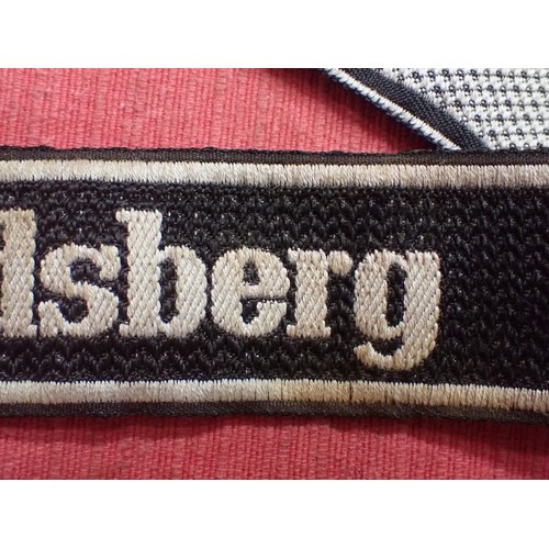 25 - WW2 German SS Frundsberg cuff title

Bevo cuff title. Folded and stitched ends. 462 mm long. Some mi... 