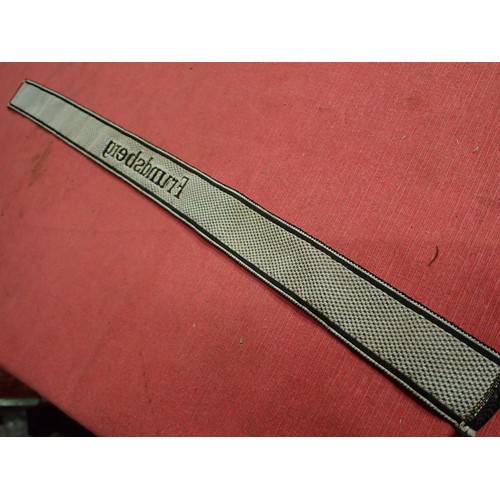 25 - WW2 German SS Frundsberg cuff title

Bevo cuff title. Folded and stitched ends. 462 mm long. Some mi... 