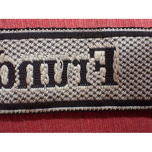 25 - WW2 German SS Frundsberg cuff title

Bevo cuff title. Folded and stitched ends. 462 mm long. Some mi... 