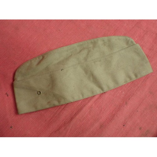 26 - U.S. Army WW2 garrison cap

Light tan cap. Good clean condition. With size label inside.