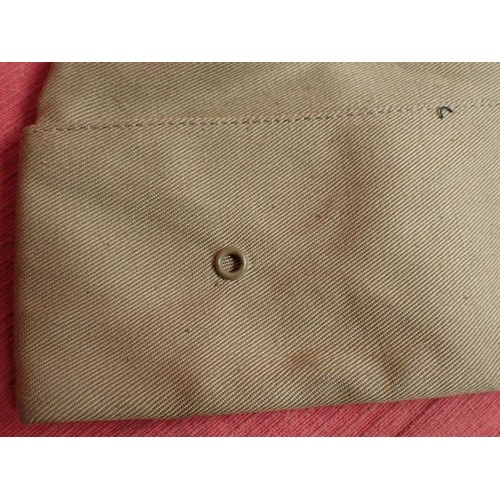 26 - U.S. Army WW2 garrison cap

Light tan cap. Good clean condition. With size label inside.