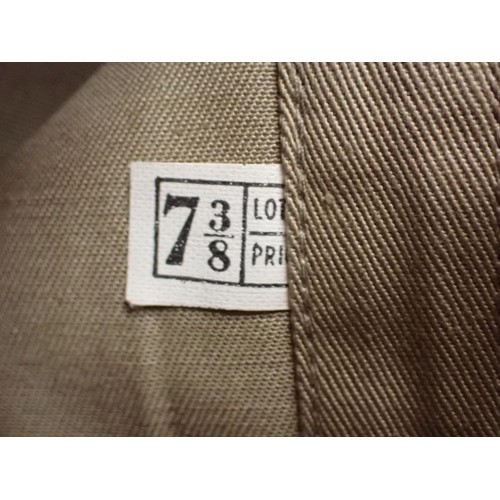 26 - U.S. Army WW2 garrison cap

Light tan cap. Good clean condition. With size label inside.