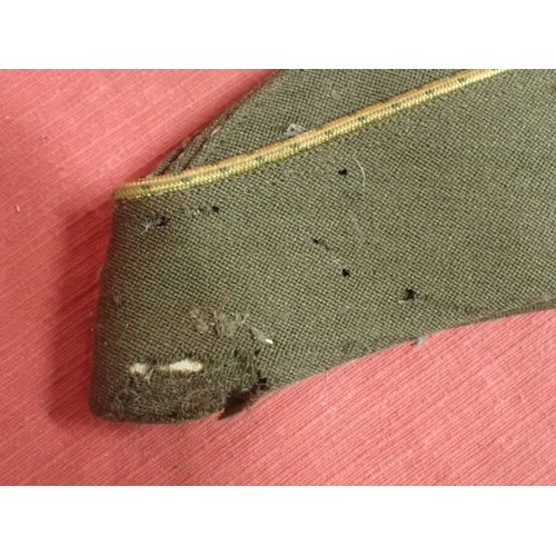 29 - U.S. WW2, two women's garrison caps

Caps with their size labels inside. The dark cap has some moth ... 