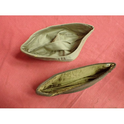 29 - U.S. WW2, two women's garrison caps

Caps with their size labels inside. The dark cap has some moth ... 