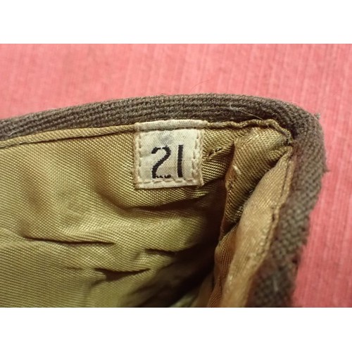 29 - U.S. WW2, two women's garrison caps

Caps with their size labels inside. The dark cap has some moth ... 