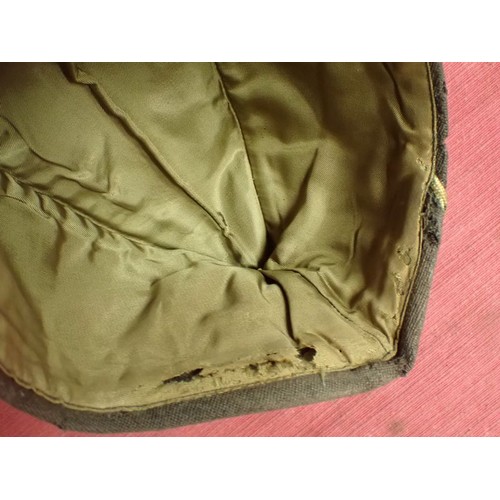 29 - U.S. WW2, two women's garrison caps

Caps with their size labels inside. The dark cap has some moth ... 