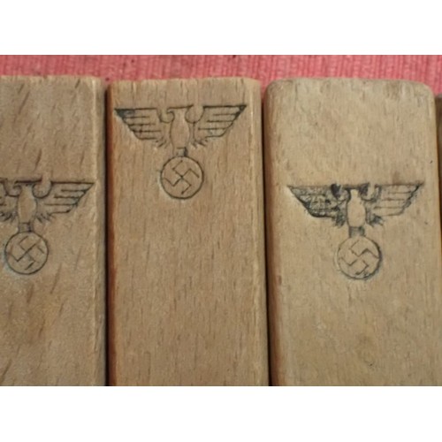 31 - WW2 German, six army marked clothing pegs

Wooden pegs with rounded edges. Around 110 mm