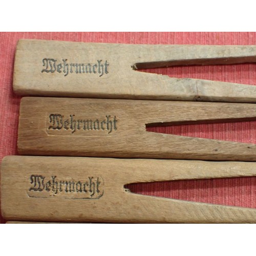 31 - WW2 German, six army marked clothing pegs

Wooden pegs with rounded edges. Around 110 mm