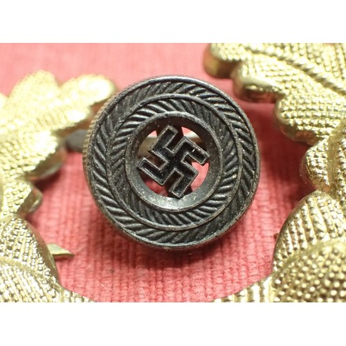 36 - WW2 German Political Leaders visor cap cockades

Gold wash finish oakleaf set. This has broken to th... 