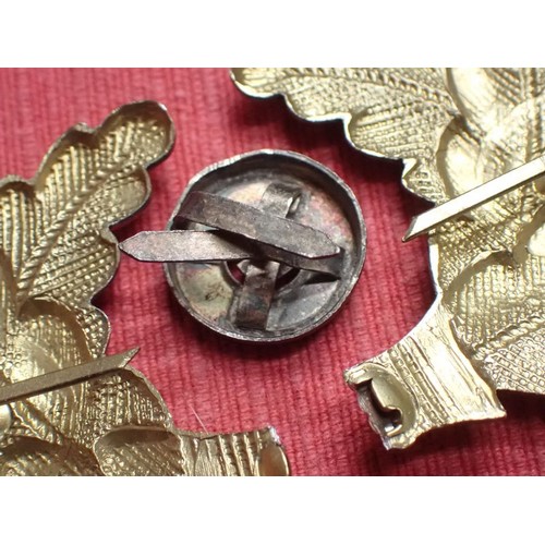 36 - WW2 German Political Leaders visor cap cockades

Gold wash finish oakleaf set. This has broken to th... 