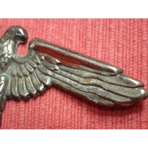 39 - WW2 German SS visor cap eagle badge

Nickel example. Missing one of its fixing pins. Grey patina