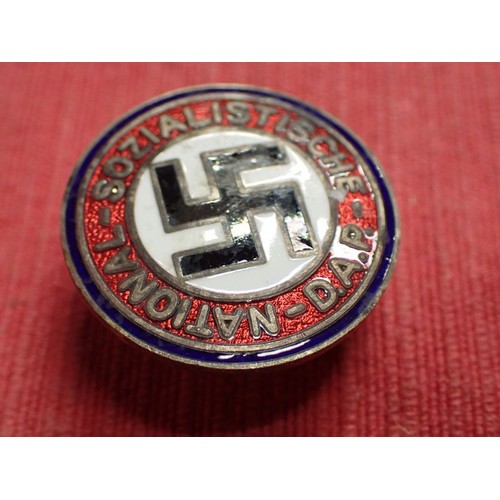41 - WW2 German NSDAP badge

Buttonhole fixing to the back. With blue district band. All the enamel compl... 