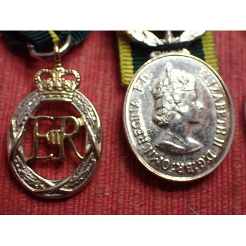 50 - British territorial medal minatures

Two territorial, and a ER2 1977 corronation medal
