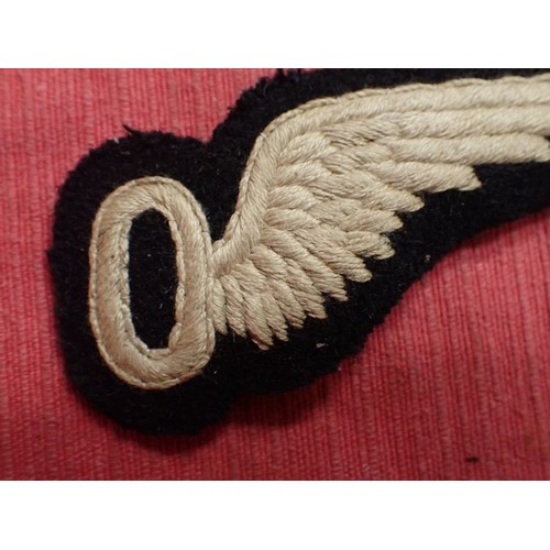 25 - WW1 British R.F.C. Observer's wing badge

Early cloth RFC observer wing with the elongated 