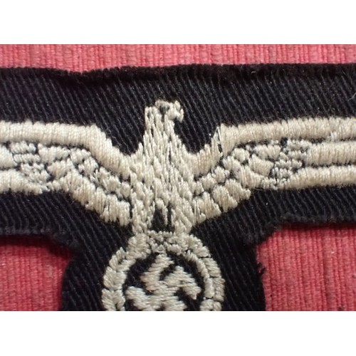 35 - WW2 German panzer crew breast eagle

Army eagle on black backing for panzer. With a crepe paper back... 