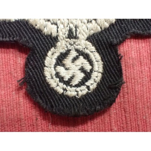 35 - WW2 German panzer crew breast eagle

Army eagle on black backing for panzer. With a crepe paper back... 