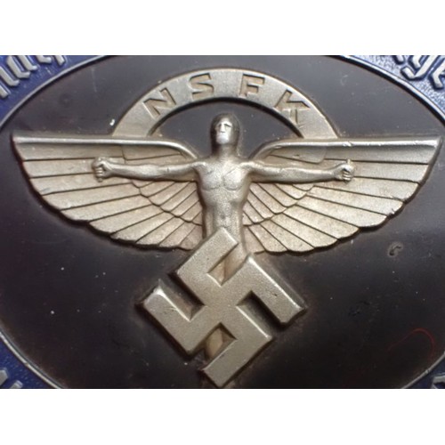 37 - 3rd Reich German 1938 N.S.F.K. plaque

Die-stamped aluminium plaque, 95 mm across. With black and bl... 