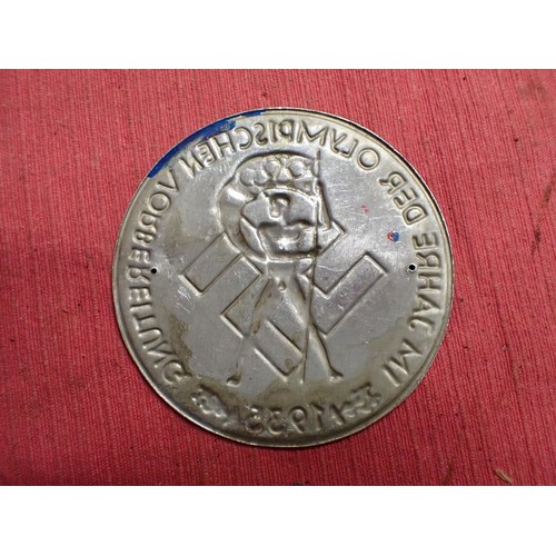 38 - 3rd Reich German Olympics 1935 plaque

Stamped aluminium plaque with blue paint to the relief. 79 mm... 