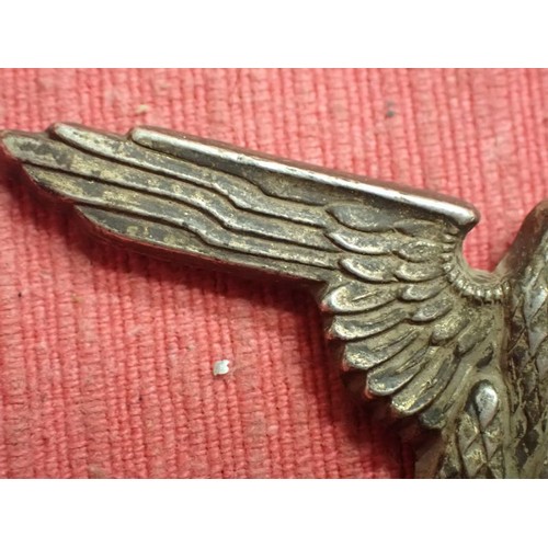 44 - WW2 German SS visor cap eagle

Nickel SS eagle. Both its fixing pins remain. Untouched patina.