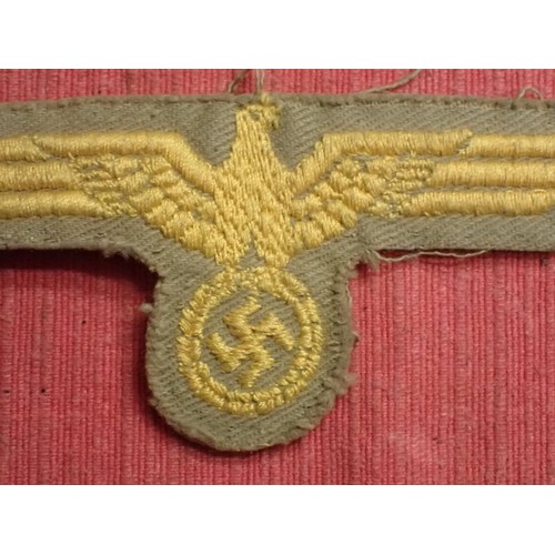 48 - WW2 German tropical coastal artillery breast eagle

With a grey felt backing. 102 mm across.