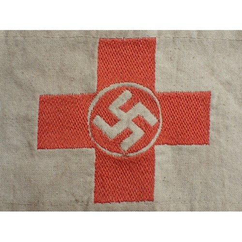 49 - WW2 German D.R.K. Red Cross armband

With a woven centre. The white is slightly discoloured; otherwi... 
