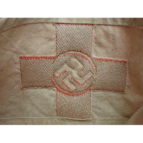 49 - WW2 German D.R.K. Red Cross armband

With a woven centre. The white is slightly discoloured; otherwi... 