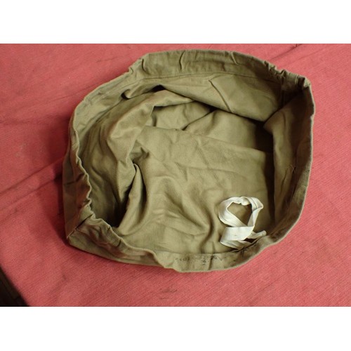 60 - WW1 British tropical pith-helmet cover dated 1914

Light tan canvas cover for the tropical helmet. M... 