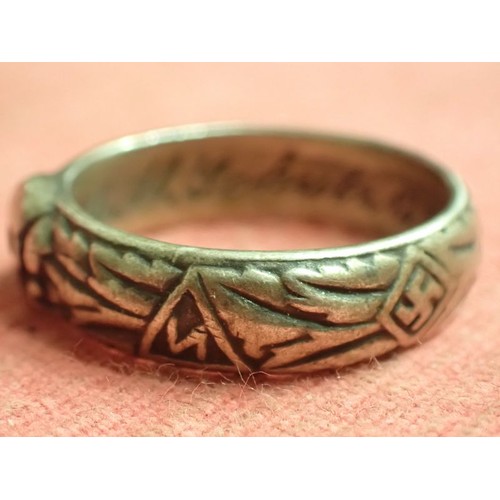 62 - WW2 German SS officers honour ring

Silver SS ring. The script on the inside appears to be , 