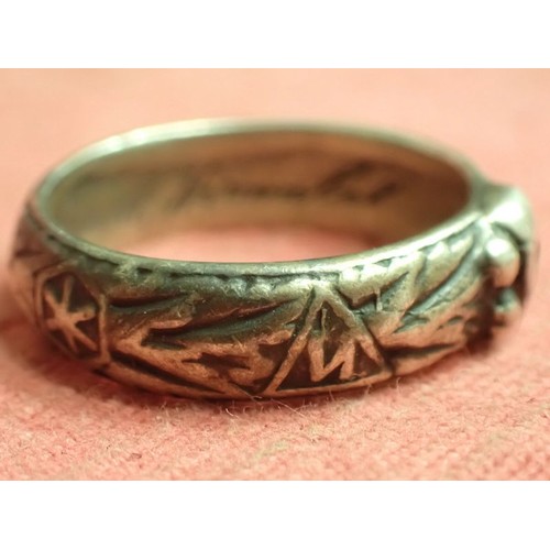 62 - WW2 German SS officers honour ring

Silver SS ring. The script on the inside appears to be , 
