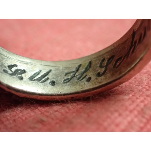 62 - WW2 German SS officers honour ring

Silver SS ring. The script on the inside appears to be , 
