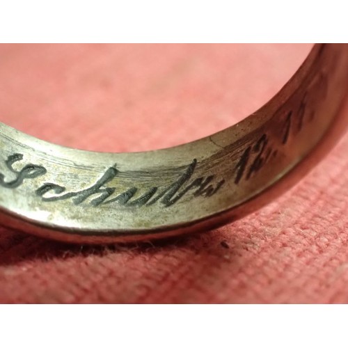 62 - WW2 German SS officers honour ring

Silver SS ring. The script on the inside appears to be , 