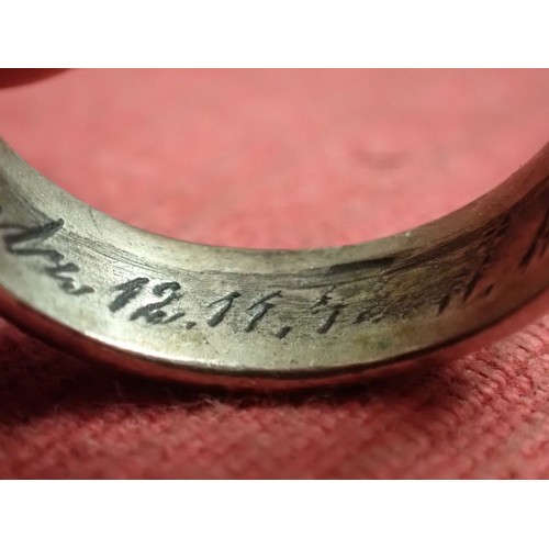 62 - WW2 German SS officers honour ring

Silver SS ring. The script on the inside appears to be , 
