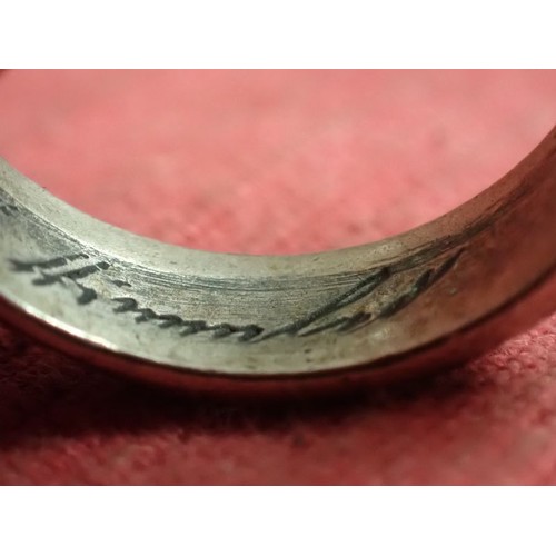 62 - WW2 German SS officers honour ring

Silver SS ring. The script on the inside appears to be , 