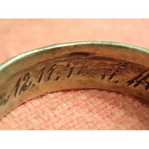 62 - WW2 German SS officers honour ring

Silver SS ring. The script on the inside appears to be , 