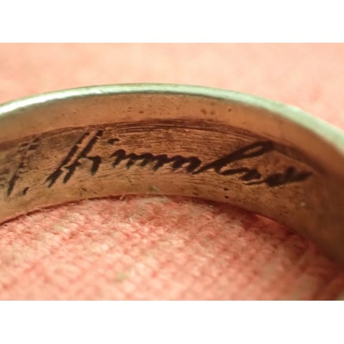 62 - WW2 German SS officers honour ring

Silver SS ring. The script on the inside appears to be , 
