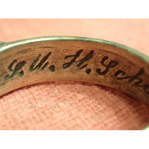 62 - WW2 German SS officers honour ring

Silver SS ring. The script on the inside appears to be , 