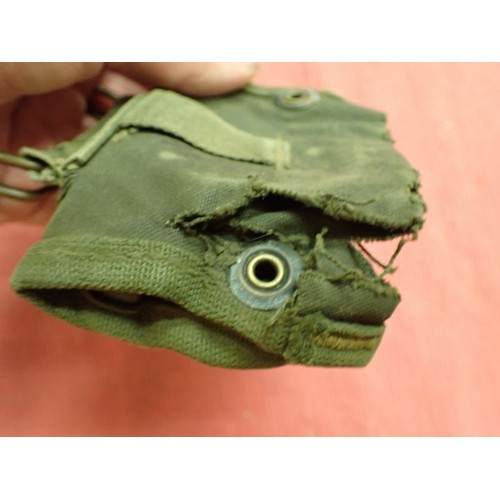 2 - 303 bandolier, a helmet camo net, a compass pouch

A 1956-dated 303 clip bandolier and a helmet net ... 