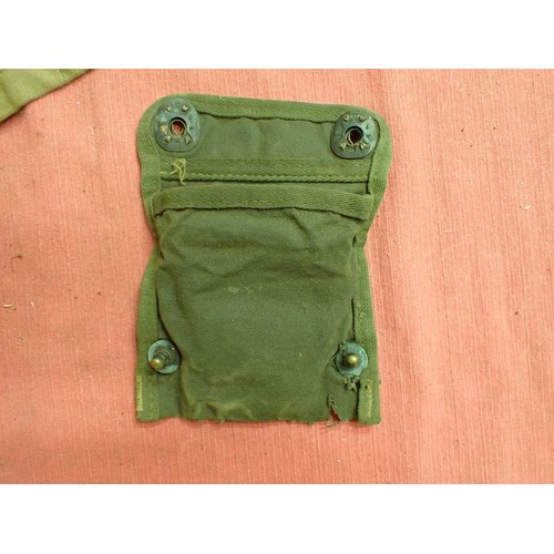 2 - 303 bandolier, a helmet camo net, a compass pouch

A 1956-dated 303 clip bandolier and a helmet net ... 