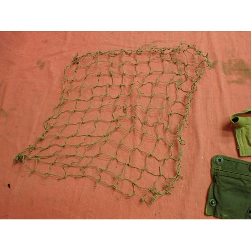 2 - 303 bandolier, a helmet camo net, a compass pouch

A 1956-dated 303 clip bandolier and a helmet net ... 