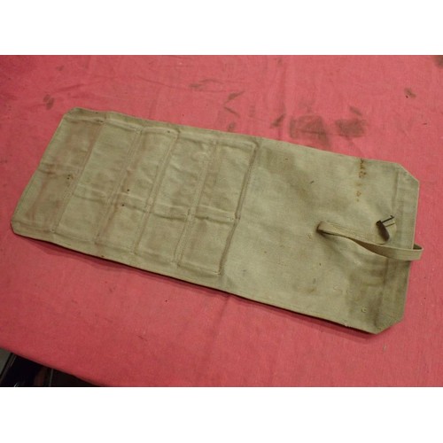 4 - WW2 British spare parts / tool roll

Maker marked dated 1942. Ten pop-stud closing compartments. 13 ... 