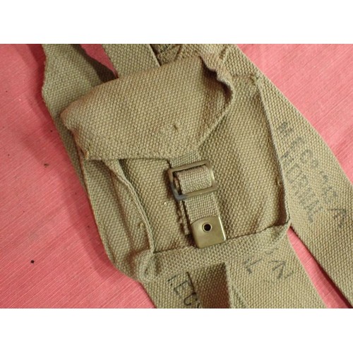 8 - Three WW2 British shoulder straps, one with fitted pouch

A matched pair dated 1943. A 1941 shoulder... 