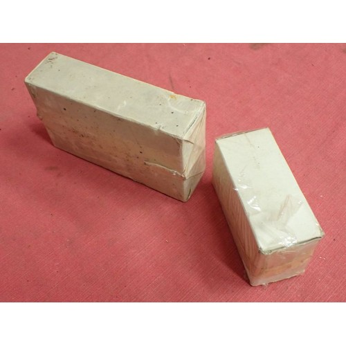 10 - Two U.S. WW2 Carlisle model field dressings

Both are still sealed in their waxed packaging. One is ... 