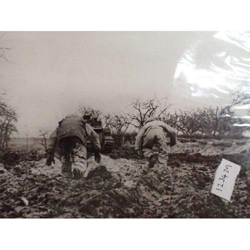 11 - Nine WW2 British press-release type photographs

Images of battle scenes and army life. Some with de... 